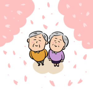 満開の桜を見上げる老夫婦